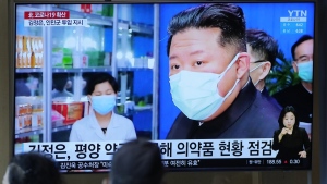 People watch a TV screen showing a news program reporting with an image of North Korean leader Kim Jong Un, at a train station in Seoul, South Korea on May 16, 2022. As an illness suspected to be COVID-19 sickens hundreds of thousands of his people, Kim stands at a critical crossroad. Does he swallow his pride and accept help or does he go it alone even though a huge number of fatalities could undermine his leadership? (AP Photo/Lee Jin-man, File)