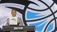 NBA Deputy Commissioner Mark Tatum announces that the Orlando Magic have won the first pick in the 2022 NBA draft during the NBA basketball draft lottery Tuesday, May 17, 2022, in Chicago. (AP Photo/Charles Rex Arbogast)