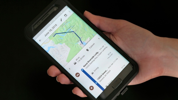 In this Aug. 8, 2018, file photo, a mobile phone displays a user's travels using Google Maps in New York. Google attracted concern about its continuous surveillance of users after The Associated Press reported that it was tracking people‚Äôs movements whether they like it or not. (AP Photo/Seth Wenig, File)