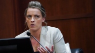 Whitney Henriquez, sister of actress Amber Heard testifies at the Fairfax County Circuit Courthouse in Fairfax, Va., Wednesday, May 18, 2022. Actor Johnny Depp sued his ex-wife Amber Heard for libel in Fairfax County Circuit Court after she wrote an op-ed piece in The Washington Post in 2018 referring to herself as a "public figure representing domestic abuse." (Kevin Lamarque/Pool Photo via AP)
