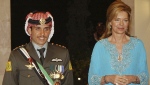 Then Crown Prince Hamzeh of Jordan, left, with his mother Queen Noor, during his wedding ceremony in Amman, Jordan, May 27, 2004.  (AP Photo/Hussein Malla, File)