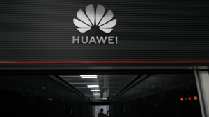 A technician stands at the entrance to a Huawei 5G data server centre at the Guangdong Second Provincial General Hospital in Guangzhou, in southern China's Guangdong province on Sept. 26, 2021. Senior government officials say the Liberals have decided to ban Chinese the vendor Huawei Technologies from Canada's long-awaited blueprint for next-generation mobile networks. THE CANADIAN PRESS/AP-Ng Han Guan