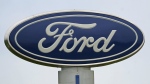 FILE - A Ford logo is seen on signage at Country Ford in Graham, N.C., Tuesday, July 27, 2021. Ford is issuing two recalls covering over 737,000 vehicles, Friday, April 1, 2022, to fix oil leaks and trailer braking systems that won't work. Ford says in government documents posted Thursday, May 19, 2022, is asking the owners of 350,000 vehicles in to take them to dealers for repairs in three recalls, including about 39,000 that should be parked outdoors because the engines can catch fire. (AP Photo/Gerry Broome, File)