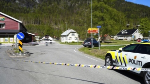 A police car on the scene of a multiple stabbing in Nore, Norway, Friday, May 20, 2022. Norwegian police say a person with a knife has wounded at least three people — one of them critically — in a random attack in a town near Oslo. They say the perpetrator has been arrested.(Lise Åserud/NTB Scanpix via AP)