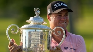 Justin Thomas poses with the Wanamaker Trophy after winning the PGA Championship golf tournament in a playoff against Will Zalatoris at Southern Hills Country Club, Sunday, May 22, 2022, in Tulsa, Okla. (AP Photo/Matt York)
