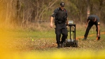 Members of the Six Nations Police conduct a search for unmarked graves using ground-penetrating radar on the 500 acres of the lands associated with the former Indian Residential School, the Mohawk Institute, in Brantford, Ont., Tuesday, November 9, 2021. THE CANADIAN PRESS/Nick Iwanyshyn