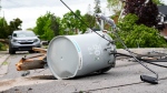 Hydro infrastructure and trees sit broken on a street in the Ottawa Valley municipality of Carleton Place, Ont. on Monday, May 23, 2022. A major storm hit the parts of Ontario and Quebec on Saturday, May 21, 2022, leaving extensive damage to infrastructure. THE CANADIAN PRESS/Sean Kilpatrick
