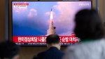 People watch a TV screen showing a news program reporting about North Korea's missile launch with file image, at a train station in Seoul, South Korea, Wednesday, May 25, 2022. North Korea launched three ballistic missiles toward the sea on Wednesday, its neighbors said, hours after President Joe Biden wrapped up his trip to Asia where he reaffirmed U.S. commitment to defend its allies in the face of the North's growing nuclear threat. (AP Photo/Lee Jin-man)