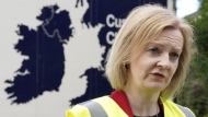 British Foreign Secretary Liz Truss speaks during a visit to McCulla Haulage to discuss the Northern Ireland protocol with businesses, in Lisburn, Northern Ireland, Wednesday May 25, 2022. THE CANADIAN PRESS/AP-Niall Carson/PA via AP