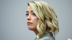 Actor Amber Heard appears in the courtroom in the Fairfax County Circuit Courthouse in Fairfax, Va., Thursday, May 26, 2022. Actor Johnny Depp sued his ex-wife Amber Heard for libel in Fairfax County Circuit Court after she wrote an op-ed piece in The Washington Post in 2018 referring to herself as a "public figure representing domestic abuse." (Michael Reynolds/Pool Photo via AP)