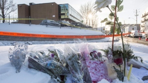 Flowers are seen near a mosque where a Sunday night shooting left six people dead and eight others injured in Quebec City, Monday, Jan. 30, 2017. The Supreme Court of Canada is slated to rule today on the sentencing of a man who went on a deadly shooting spree at a Quebec City mosque. THE CANADIAN PRESS/Paul Chiasson