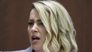 Actor Amber Heard testifies in the courtroom in the Fairfax County Circuit Courthouse in Fairfax, Va., Thursday, May 26, 2022. Actor Johnny Depp sued his ex-wife Amber Heard for libel in Fairfax County Circuit Court after she wrote an op-ed piece in The Washington Post in 2018 referring to herself as a "public figure representing domestic abuse." (Michael Reynolds/Pool Photo via AP)