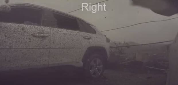 Debris is shown hitting a vehicle in Uxbridge as a EF2 tornado touched down over the weekend. (CanuckChris/YouTube)