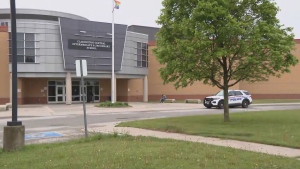 A police cruiser is shown parked outside Clarington Central Secondary School on Friday following an investigation into threats. 