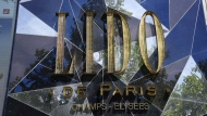 The logo of the cabaret Le Lido is pictured on the Champs-Elysees avenue in Paris, Wednesday, May 18, 2022. It’s the end of an era for the famed Lido cabaret on Paris’ Champs-Elysees. Amid financial troubles and changing times, the venue’s new corporate owner is ditching most of the Lido’s staff and its high-kicking, high-glamour dance shows. (AP Photo/Christophe Ena)