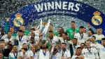 Real Madrid's Marcelo lifts the trophy after winning the Champions League final soccer match between Liverpool and Real Madrid at the Stade de France in Saint Denis near Paris, Saturday, May 28, 2022. Real Madrid defeated Liverpool 1-0.(AP Photo/Manu Fernandez)