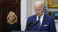 FILE - President Joe Biden pauses as he speaks about the mass shooting at Robb Elementary School in Uvalde, Texas, from the Roosevelt Room at the White House, in Washington, May 24, 2022, as first lady Jill Biden listens. (AP Photo/Manuel Balce Ceneta, File)