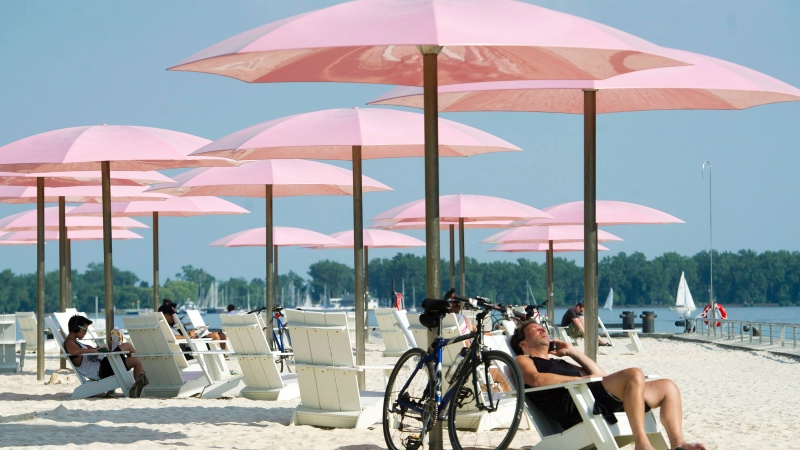 People take in the sun at Sugar Beach in Toronto. THE CANADIAN PRESS/Nathan Denette