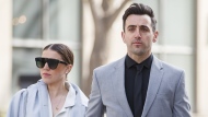 Canadian musician Jacob Hoggard arrives alongside his wife Rebekah Asselstine, for his sexual assault trial at the Toronto courthouse on Tuesday, May 10, 2022, in Toronto. THE CANADIAN PRESS/Cole Burston