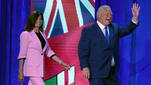 Ontario Premier Doug Ford and wife Karla walk onstage after being re-elected in the Ontario provincial election, in Toronto, Thursday, June 2, 2022. THE CANADIAN PRESS/Nathan Denette 