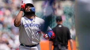 Toronto Blue Jays' Vladimir Guerrero Jr. looks skyward as he crosses home plate after his two-run home run during the fourth inning of a baseball game Detroit Tigers, Sunday, June 12, 2022, in Detroit. (AP Photo/Carlos Osorio)