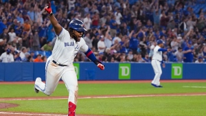 Toronto Blue Jays first baseman Vladimir Guerrero Jr. (27) reacts after hitting an game winning RBI single to defeat the Baltimore Orioles during tenth inning American League, MLB baseball action in Toronto on Wednesday, June 15, 2022. THE CANADIAN PRESS/Nathan Denette