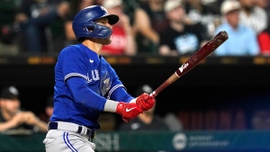 Toronto Blue Jays' Cavan Biggio watches his two-run home run during the ninth inning of a baseball game against the Chicago White Sox Monday, June 20, 2022, in Chicago. The Blue Jays lost 8-7. (AP Photo/Charles Rex Arbogast)