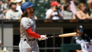 Toronto Blue Jays' Bo Bichette watches his grand slam home run during the fourth inning of a baseball game against the Chicago White Sox, Wednesday, June 22, 2022, in Chicago. (AP Photo/Paul Beaty)