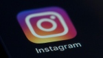 FILE - This Friday, Aug. 23, 2019, file photo shows the Instagram app icon on the screen of a mobile device in New York. Instagram is testing new ways to verify people's age to use the service, including a face-scanning artificial intelligence tool, having mutual friends verify their age or uploading an ID. But the tools won't be used, at least not yet, to try to keep children off of the popular photo and video-sharing app. Rather, they are only for verifying that someone is 18 or older. (AP Photo/Jenny Kane, File)