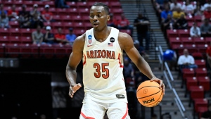 Arizona center Christian Koloko (35) dribbles against Wright State during the first half of a first-round NCAA college basketball tournament game, Friday, March 18, 2022, in San Diego. (AP Photo/Denis Poroy) 