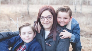 Jennifer Henson and her sons Kayden, left, and Chase are seen in Calgary in this undated handout image provided June 22, 2022. A steep hike in gas prices and cost of living has been an adjustment for many Canadians, particularly Henson, a mail carrier who says her out-of-pocket cost of delivering packages along her rural route has doubled. THE CANADIAN PRESS/HO-Junebug photography, 
