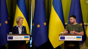 FILE - Ukraine President Volodymyr Zelenskyy speaks during a joint press conference with European Commission President Ursula von der Leyen, left, in Kyiv, Ukraine, Saturday, June 11, 2022. (AP Photo/Natacha Pisarenko, Filw)