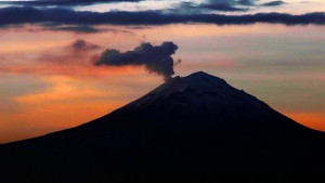 A plume of ash and steam rise from the Popocatepetl volcano, as seen from Mexico City, Wednesday, June 19, 2019. (AP Photo/Marco Ugarte) 
