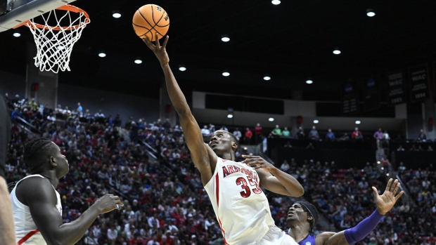 Arizona centre Christian Koloko stretches to put up a shot against TCU during first half second-round NCAA college basketball tournament action, in San Diego, Sunday, March 20, 2022. It's fitting that one of the first people to reach out to Christian Koloko after he was drafted by Toronto on Thursday was new Raptors teammate Pascal Siakam. The two come from the same town of Douala in Cameroon. THE CANADIAN PRESS/AP-Denis Poroy