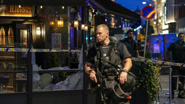 Police stand guard at the site of a mass shooting in Oslo, early Saturday, June 25, 2022. Norwegian police say a few people have been killed and more than a dozen injured in a mass shooting. (Javad Parsa/NTB via AP)