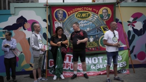 FILE - Workers and members of the RMT (The National Union of Rail, Maritime and Transport Workers) union stand on a picket line outside Paddington train station, in London, during a railway workers strike, on June 23, 2022. As food costs and fuel bills soar, inflation is plundering people’s wallets, sparking a wave of protests and workers’ strikes around the world. (AP Photo/Matt Dunham)