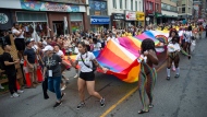 People march in the Pride parade marking the return of in-person festivities for the annual LGBTQ celebration, in Toronto, Sunday, June 26, 2022. THE CANADIAN PRESS/Eduardo Lima 