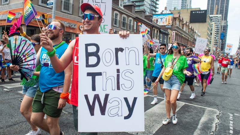 People march in the Pride parade marking the return of in-person festivities for the annual LGBTQ celebration, in Toronto, Sunday, June 26, 2022. THE CANADIAN PRESS/Eduardo Lima 