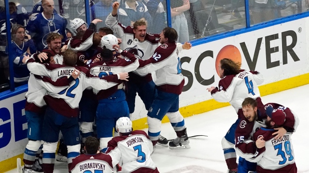 The Colorado Avalanche celebrate after the team defeated the Tampa Bay Lightning in Game 6 of the NHL hockey Stanley Cup Finals on Sunday, June 26, 2022, in Tampa, Fla. The Avalanche won 2-1. (AP Photo/John Bazemore)