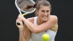 Rebecca Marino of Canada plays a return to Camila Giorgi of Italy during their singles tennis match at the Eastbourne International tennis tournament in Eastbourne, England, Tuesday, June 21, 2022. (AP Photo/Kirsty Wigglesworth)