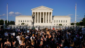 FILE - Protesters fill the street in front of the Supreme Court after the court's decision to overturn Roe v. Wade in Washington, June 24, 2022. (AP Photo/Jacquelyn Martin)