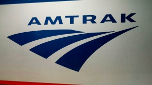 FILE - In this Feb. 6, 2014 file photo, an Amtrak logo is seen on a train at 30th Street Station in Philadelphia. (AP Photo/Matt Rourke, File) 