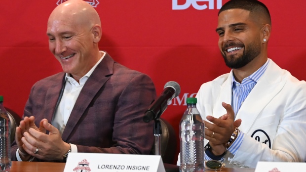 Toronto Football Club's president Bill Manning, left, introduces the club's new forward, Lorenzo Insigne, during a press conference at BMO Field in Toronto on Monday, June 27, 2022. THE CANADIAN PRESS/Jon Blacker