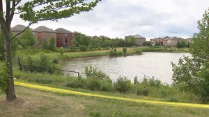 Police tape is seen around a Brampton pond where a missing woman was found dead.
