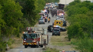 Police block the scene where a semitrailer with multiple dead bodies were discovered, Monday, June 27, 2022, in San Antonio. (AP Photo/Eric Gay)