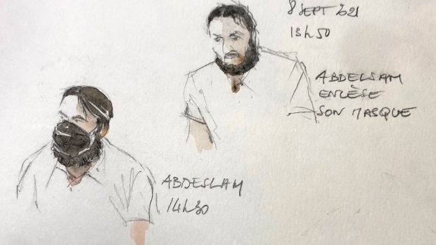 This sketch shows key defendant Salah Abdeslam with and without a mask, with text reading Abadelsam removes his mask, in the special courtroom built for the 2015 attacks trial, Wednesday, Sept. 8, 2021 in Paris. The trial of 20 men accused in the Islamic State group's coordinated attacks on Paris in 2015 that transformed France opened Wednesday in a custom-built complex embedded within a 13th-century courthouse. Nine gunmen and suicide bombers struck within minutes of each other at several locations around Paris on Nov. 13, 2015, leaving 130 people dead and spreading fear across the nation. (AP Photo/Noelle Herrenschmidt)