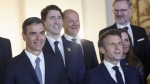 Spain's Prime Minister Pedro Sanchez, left, France's President Emmanuel Macron, Canada's Prime Minister Justin Trudeau, center left, Germany's Chancellor Olaf Scholz, center, Czech Prime Minister Petr Fiala, and Iceland's Prime Minister Katrin Jakobsdottir pose for a group photo with Spain's King Felipe and Queen Letizia and NATO leaders before a gala dinner at the Royal Palace in Madrid, Spain, Tuesday, June 28, 2022. North Atlantic Treaty Organization heads of state will meet for a NATO summit in Madrid from Tuesday through Thursday. THE CANADIAN PRESS/Jonathan Ernst/Pool via AP
