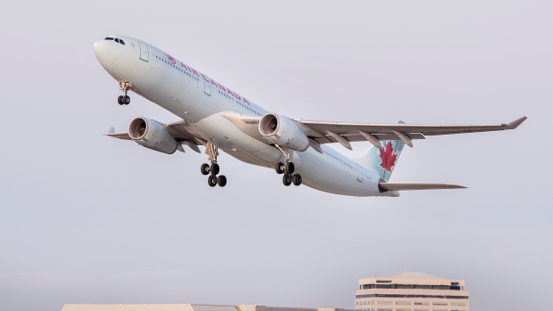An Air Canada plane takes off from Montreal Trudeau Airport in Montreal, Sunday, December 5, 2021, as the COVID-19 pandemic continues in Canada and around the world. THE CANADIAN PRESS/Graham Hughes 