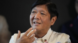 FILE - Philippine President-elect Ferdinand "Bongbong" Marcos Jr. gestures during a press conference at his headquarters in Mandaluyong, Philippines on June 20, 2022. Ferdinand Marcos Jr., the namesake son of an ousted dictator, is to be sworn in as Philippine president Thursday, June 30, in one of history's greatest political comebacks but which opponents say was pulled off by whitewashing his family’s image. (AP Photo/Aaron Favila, File)