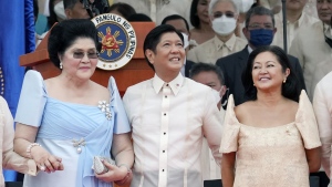 President Ferdinand Marcos Jr. stands with his mother Imelda Marcos, left, and his wife Maria Louise Marcos, right, during the inauguration ceremony at National Museum on Thursday, June 30, 2022 in Manila, Philippines. Marcos was sworn in as the country's 17th president. (AP Photo/Aaron Favila)